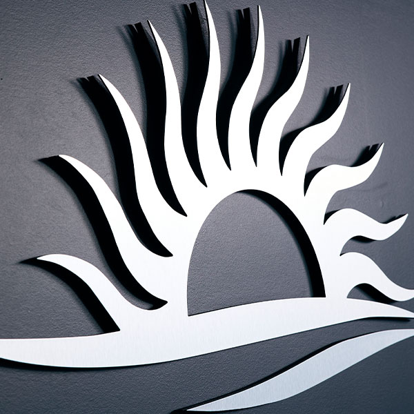 A sun logo for Dermatology Associates & Skin Cancer Center in Panama City, FL.